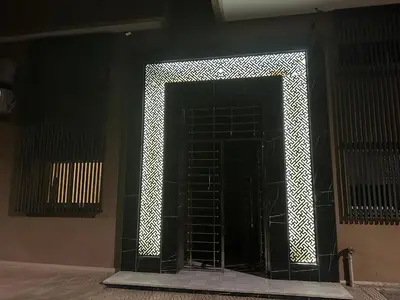 a black door with a lattice pattern on it at House of Jade Marrakech in Marrakech