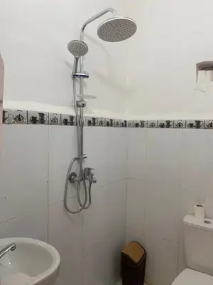 a bathroom with a shower and a toilet and a sink at Dwira in Marrakech