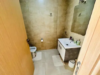 a bathroom with a sink and a toilet at Family Palms Luxe Villa Marrakech with Private Pool in Marrakech