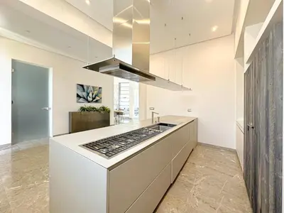 a kitchen with a white counter top and a stove at Villa LEONARDO Piscine & Rooftop Terrase in Marrakech