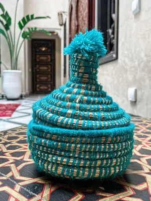 a peacock statue sitting on top of a table at Riad Deluxe in Marrakech