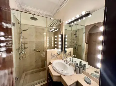a bathroom with a sink and a shower at The Majestic Marrakesh Villa 2 in Marrakech