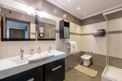 a bathroom with a sink and a toilet at Luxury Villa 6 ROOMS with Pool - Marrakech Center in Marrakech