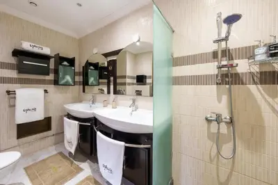 a bathroom with two sinks and a shower at Luxury Villa 6 ROOMS with Pool - Marrakech Center in Marrakech