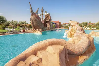 a large pool with a snake in the water at Vizir Center Appartements in Dar Caïd Layadi