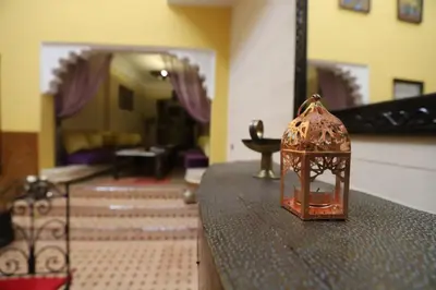 a bird cage sitting on a counter in a room at Riad BAHIA in Marrakech