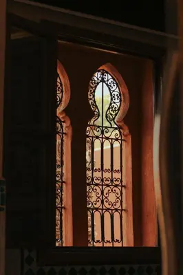a window with a wrought iron grate on it at Le Palais Averroes - Adults Only in Marrakech