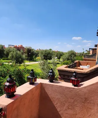 a group of lights sitting on a concrete wall at Tres joli Apparemment atlas golf rosort by marwa € ilyes in Marrakech