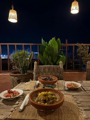 a table with plates of food on top at Riad Hanya in Marrakech