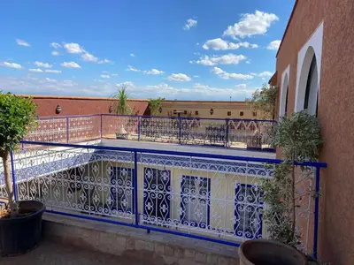 a balcony with a blue and white railing at Le riad de Salima, Noor Es Saadi design in Marrakech