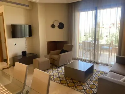 a living room with a couch and a table at Appartement Privé 1 Chambre Vizir Center Marrakech in Marrakech