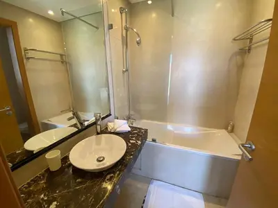 a bathroom with a sink and a shower and a tub at Appartement Privé 1 Chambre Vizir Center Marrakech in Marrakech
