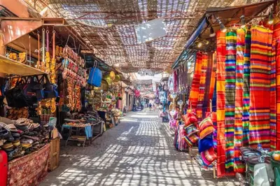 an alley in a market with a lot of shops at Sunny terrace & comfy beds in Marrakech in Marrakech