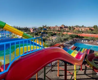 a water park with a slide and a pool at Marrakech Atlas Golf Resort appartement 2 chambres,Piscines in Marrakech