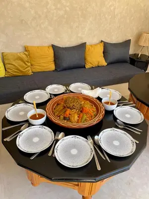 a table with a large plate of food on a table at Riad Celema & Spa in Marrakech
