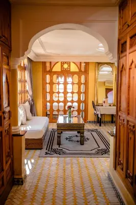 a living room with a bed and a table at Penthouse Marrakech in Marrakech
