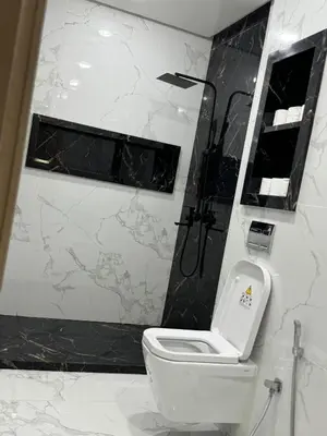 a bathroom with a white toilet and a shower at Marrakesh manara in Marrakech