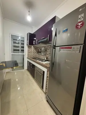 a kitchen with a stainless steel refrigerator and cabinets at Marrakesh manara in Marrakech