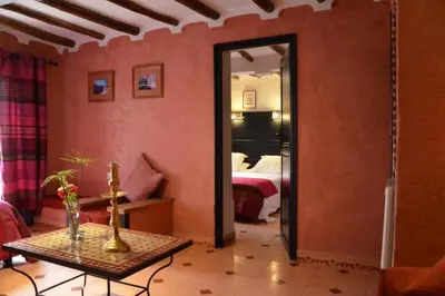 a room with a room with a bed and a table at GREEN HOUSE in Marrakech