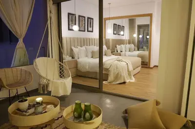 a bedroom with two beds and a large mirror at S_house in Marrakech