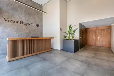 a lobby with a reception desk in a building at Duplex de Luxe Victor Hugo Gueliz in Marrakech