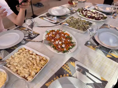a table with many plates of food on it at Superbe villa avec piscine privée - Golf Amelkis in Marrakech