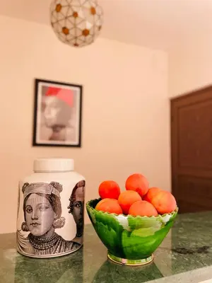 a can and a bowl of oranges on a counter at Riad Deha & Spa in Marrakech