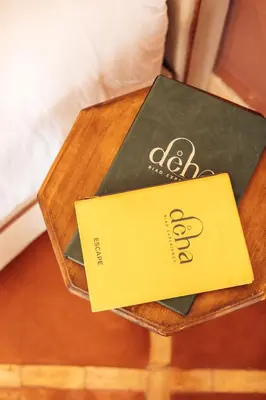 a book sitting on top of a wooden table at Riad Deha & Spa in Marrakech