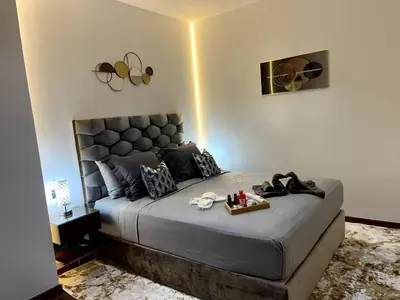 a bedroom with a large bed with a tray on it at Luxury apartment in center of gueliz in Marrakech