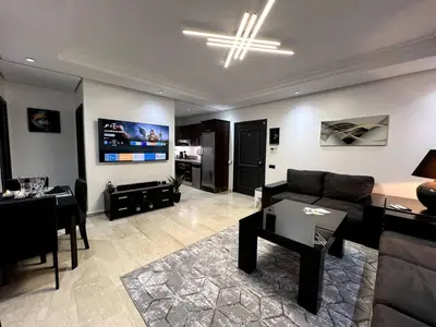 a living room with a couch and a table at Luxury apartment in center of gueliz in Marrakech