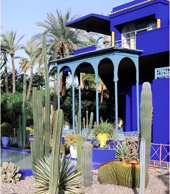 a blue house with cacti in front of it at Élégant Refuge à Deux Pas du Célèbre Jardin Majorelle in Marrakech