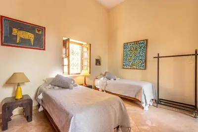 a bedroom with two beds and a window at Riad Dar Al Barakaa - EXCLUSIVE - Breakfast in Marrakech