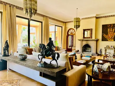 a living room with a statue of a woman riding a horse at Majestic Luxury Villa Marrakech in Marrakech