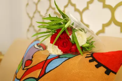 a bouquet of flowers on top of a table at Riad Safran Rouge Jacuzzi RoofTop in Marrakech