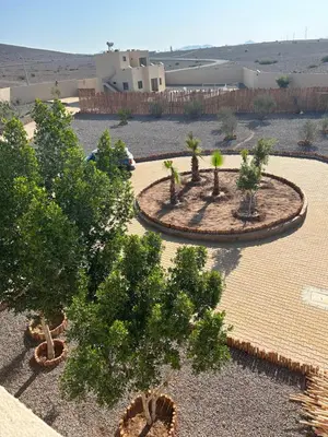 an overhead view of a garden with trees and shrubs at Villa 5 chambres route de Casablanca Marrakech in Marrakech