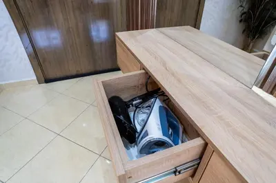 a wooden counter top with a appliance inside of it at L'horizon Aéroport Appartement in Marrakech