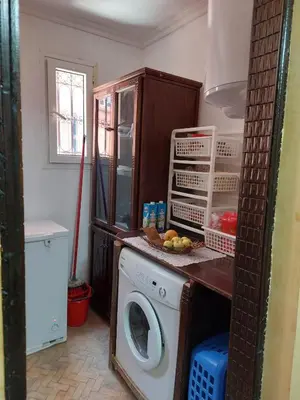 a kitchen with a washing machine in a kitchen at Riad Habib - Traditional Moroccan 3 bedroom family home in Marrakech