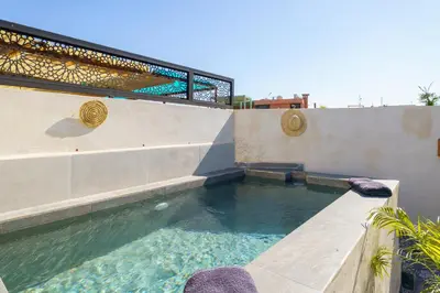 a pool of water in a building with a staircase at Riad AJI 4 Rooms, Pool, Internet, Top Emplacement Médina in Marrakech