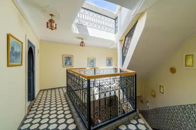 an empty hallway with a staircase with a skylight at Riad AJI 4 Rooms, Pool, Internet, Top Emplacement Médina in Marrakech