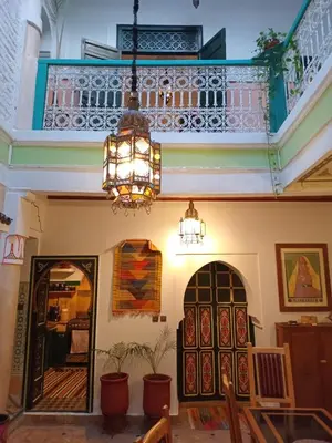 a chandelier hanging from the ceiling in a room at Riad El Badii chambre queen size Badii in Marrakech