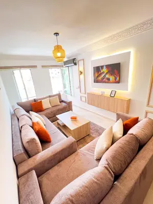 a large living room with a couch and a table at Apartment for Rent Luxury Stay Near to Jemaa el-Fnaa in Marrakech