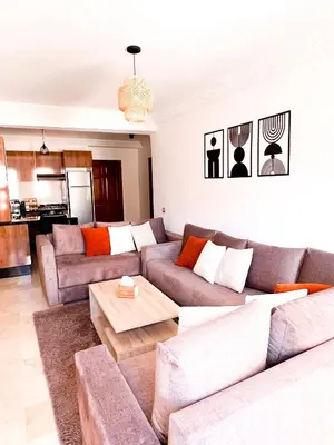 a living room with a couch and a table at Apartment for Rent Luxury Stay Near to Jemaa el-Fnaa in Marrakech