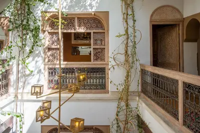 a building with a window and lights on the stairs at Riad Bed & Breakfast Comptoir du Pacha in Marrakech