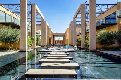 a lobby of a building with a pool of water at Duplex Moderne 233m2 dans une magnifique résidence in Marrakech