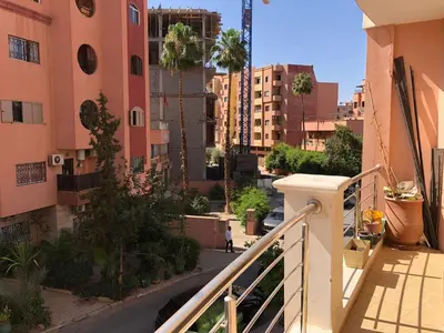 a balcony with a view of a street and buildings at studio avec terasse carre eden iptv wifi in Marrakech