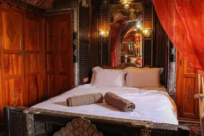 a bed with two pillows on it in a room at Atypical functional flat Gueliz close Garden Harti in Marrakech