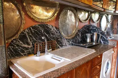 a kitchen with a sink and some pots and pans at Atypical functional flat Gueliz close Garden Harti in Marrakech