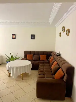 a living room with a couch and a table at Superbe appartement à Marrakech quartier Majorelle 2 chambres in Marrakech
