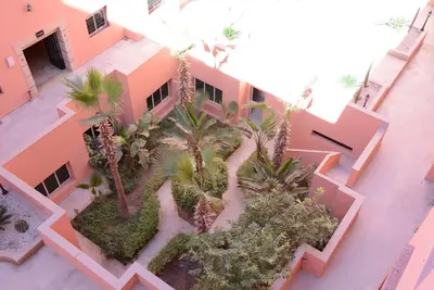 an aerial view of a building with palm trees at apartment Marrakech, gueliz in Marrakech