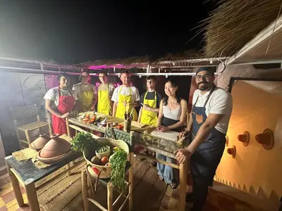 a group of people standing around a table with vegetables at Peekaboo Hostel in Marrakech